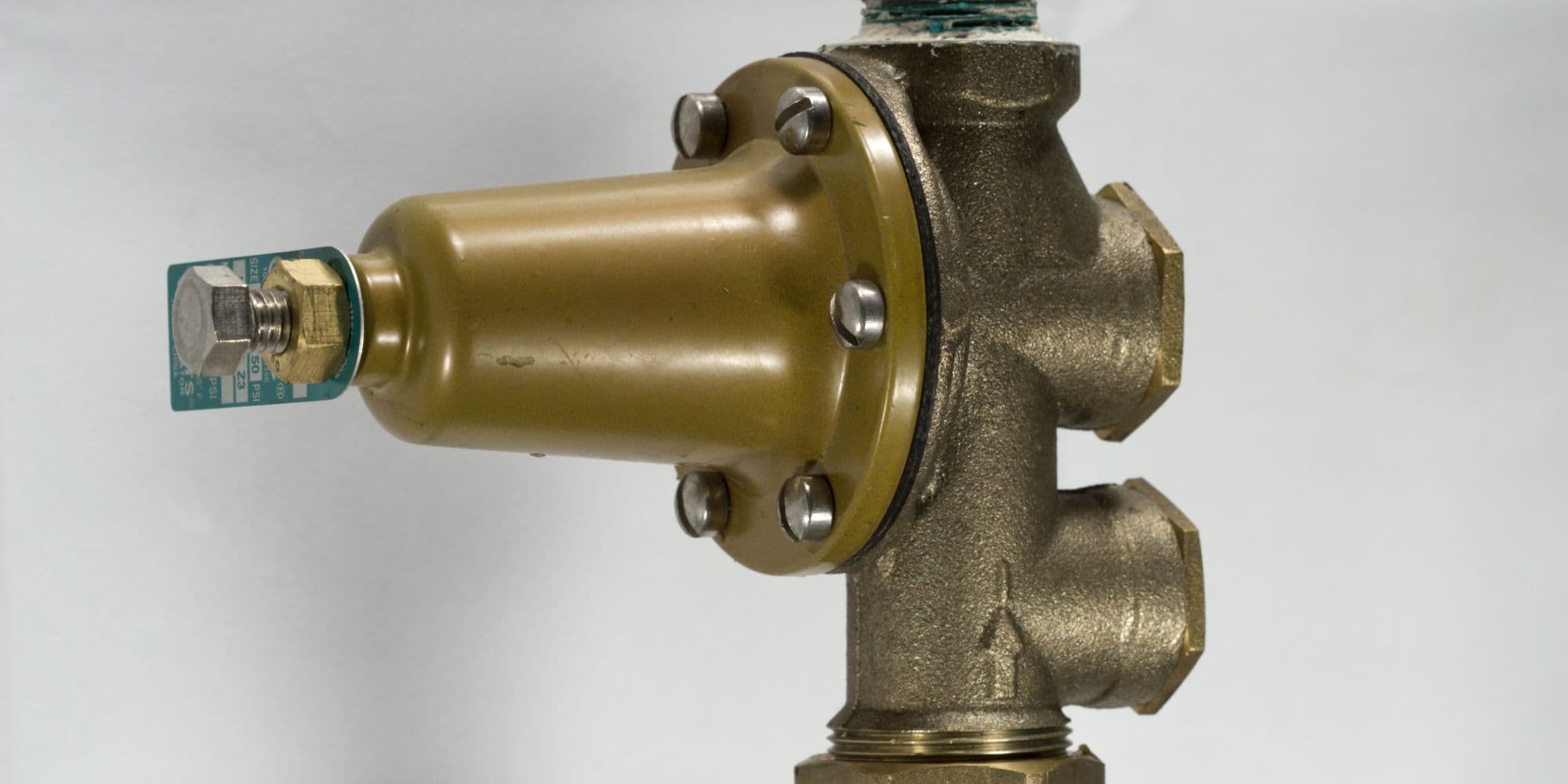 A water pressure regulator installed in home plumbing systems.
